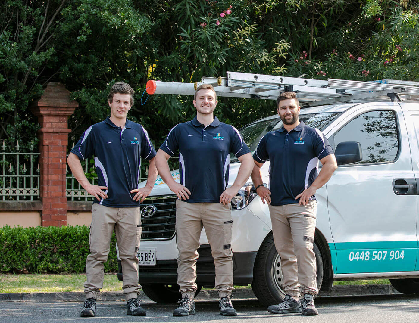 Professional plumbers inspecting plumbing systems with a toolkit.