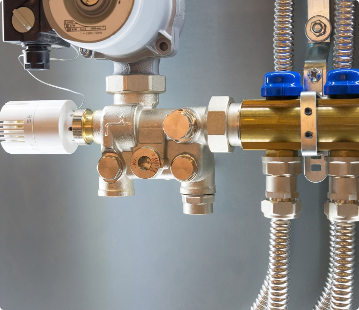 A plumber inspecting pipes for maintenance plumbing.